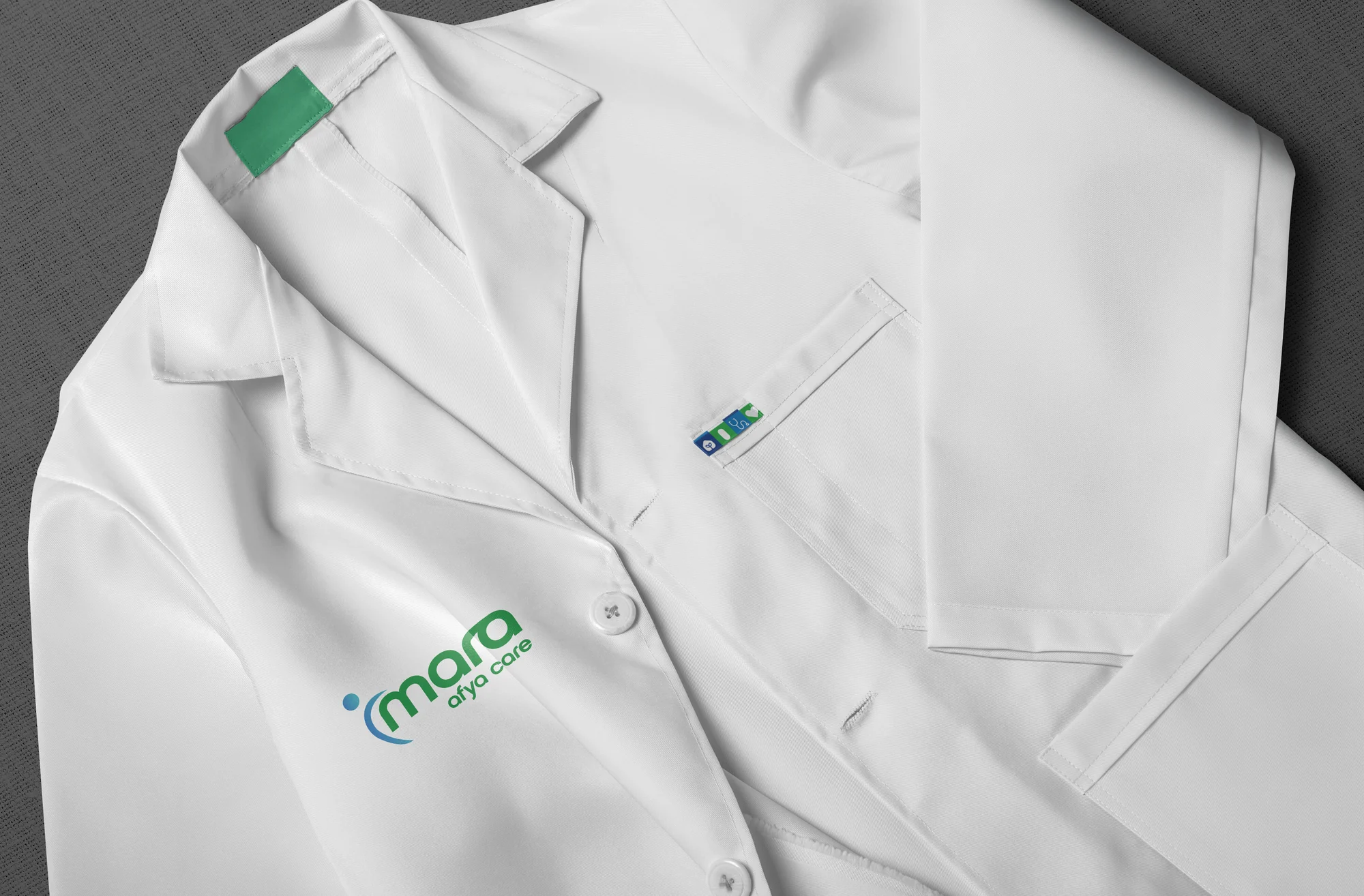 Imara Afya Care identity on a medical lab coat mockup